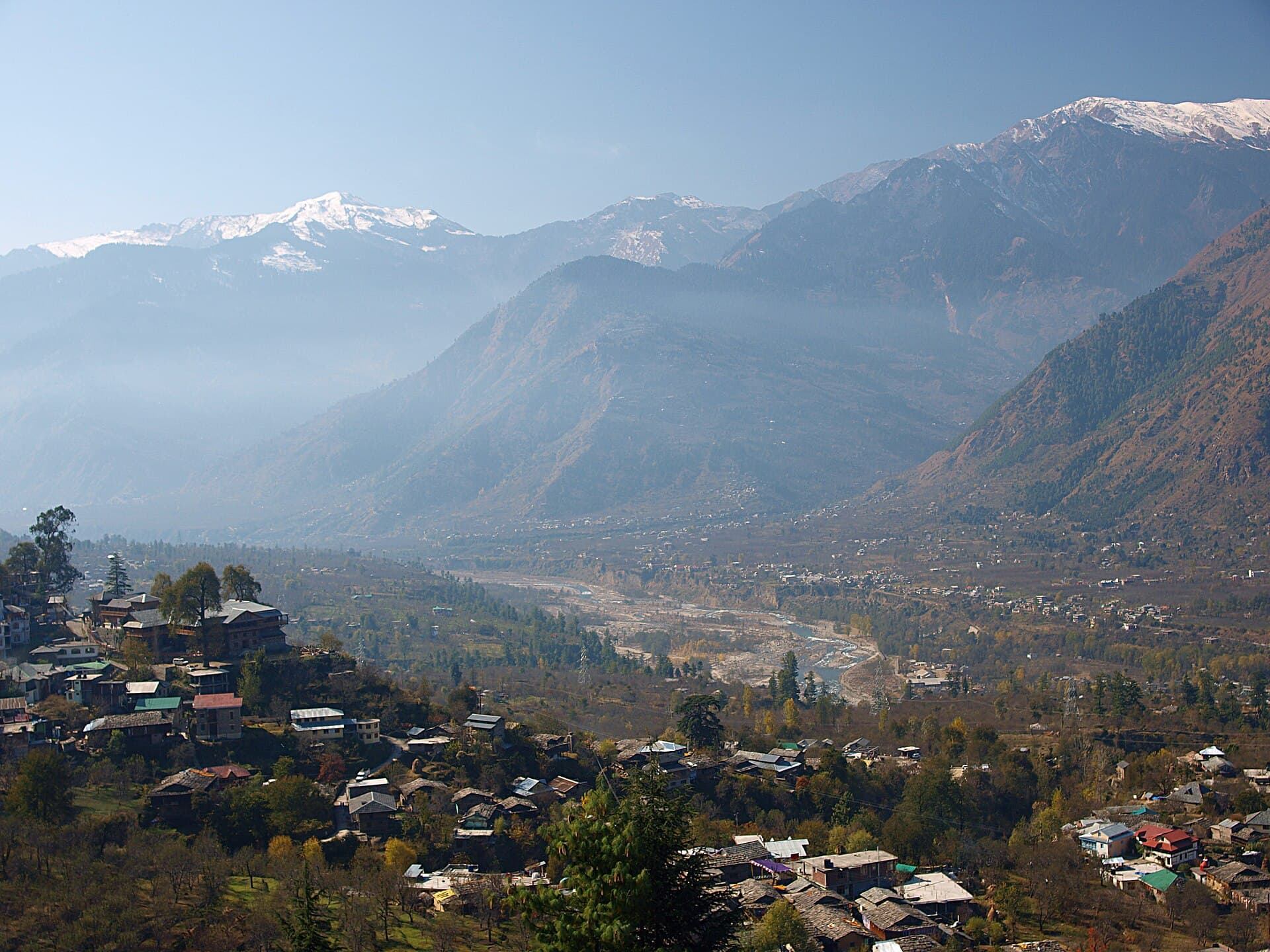 Snow-topped Himalayan peaks seen across the Kullu valley