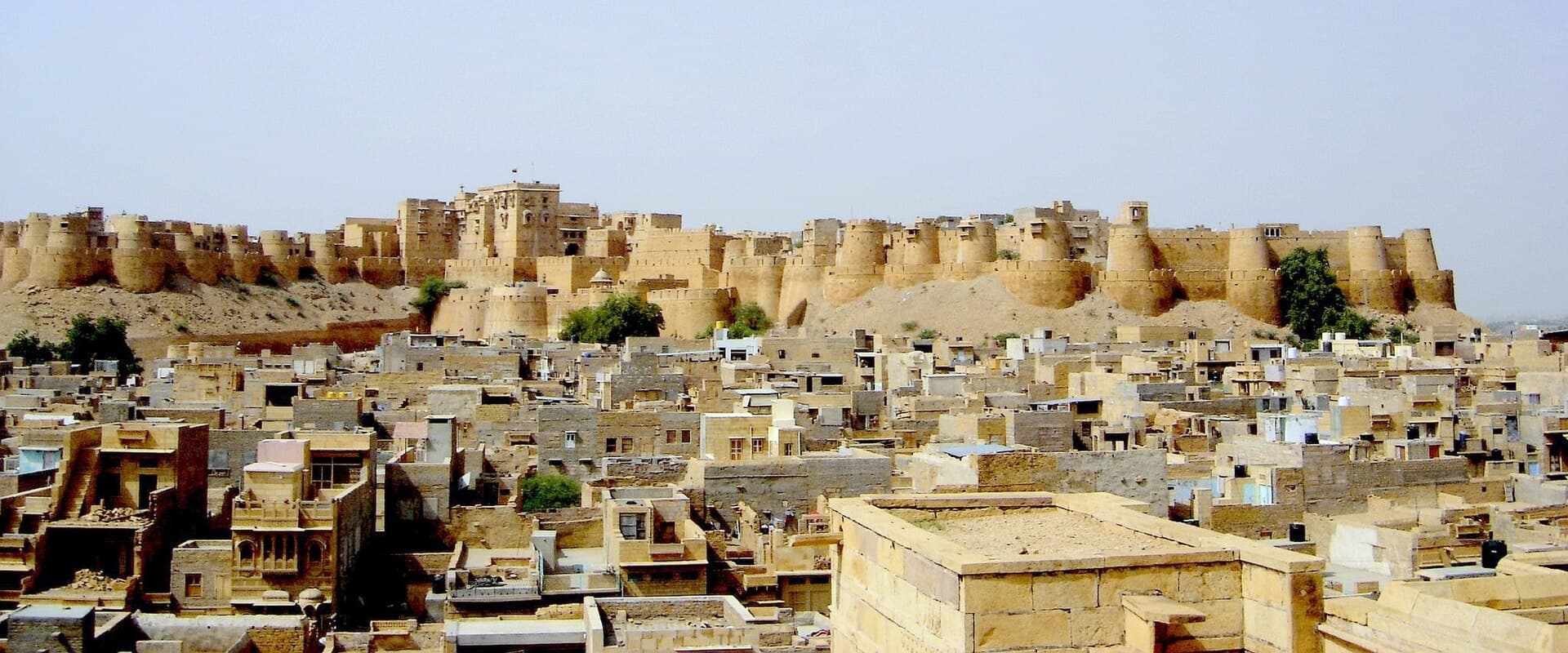 The sandstone walls of Jaisalmer fort rising above the desert city
